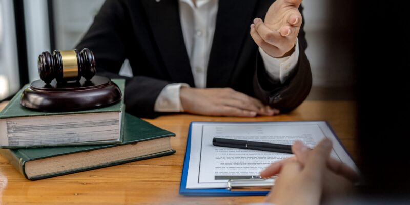 Client was listening to a lawyer advising on an embezzlement case, explaining the details of the proceeding and gathering evidence to file a lawsuit against the defendant. The concept of litigation. Client was listening to a lawyer advising on an embezzlement case, explaining the details of the proceeding and gathering evidence to file a lawsuit against the defendant. The concept of litigation.